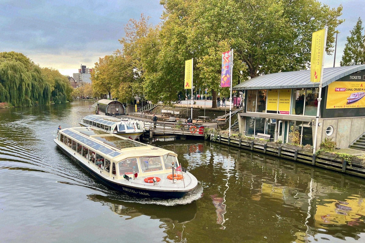 Canal boat at a jetty for canal cruises near Museumplein
