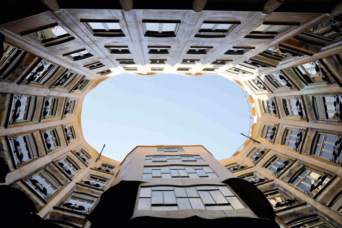 Oval courtyard of Casa Milà with its curved facade windows