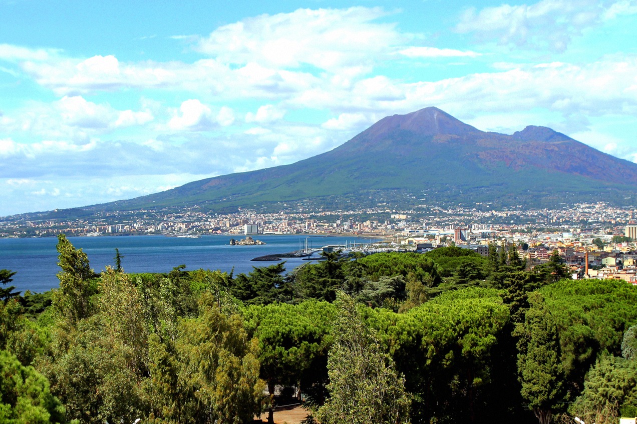 View from Castellammare di Stabia over the Gulf of Naples to Vesuvius, framed by pine trees