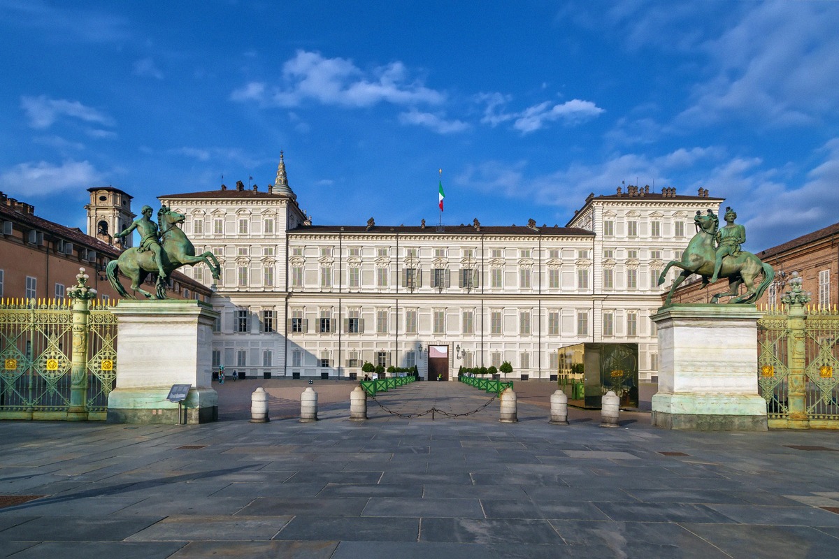 Front facade of the Palazzo Reale on Piazza Castello with the Italian and EU flags