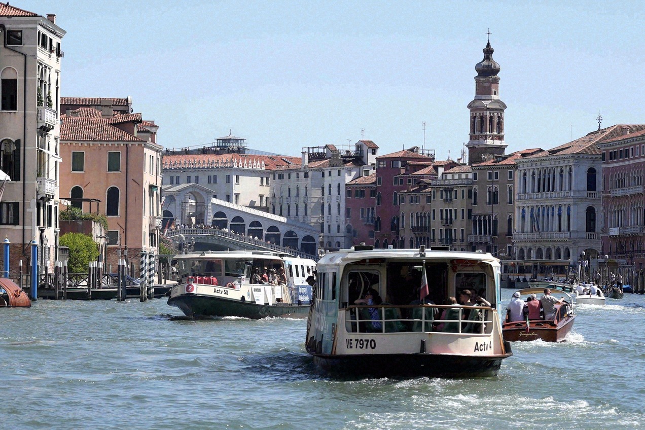 The Grand Canal in Venice with vaporetti in the foreground and the Rialto Bridge behind