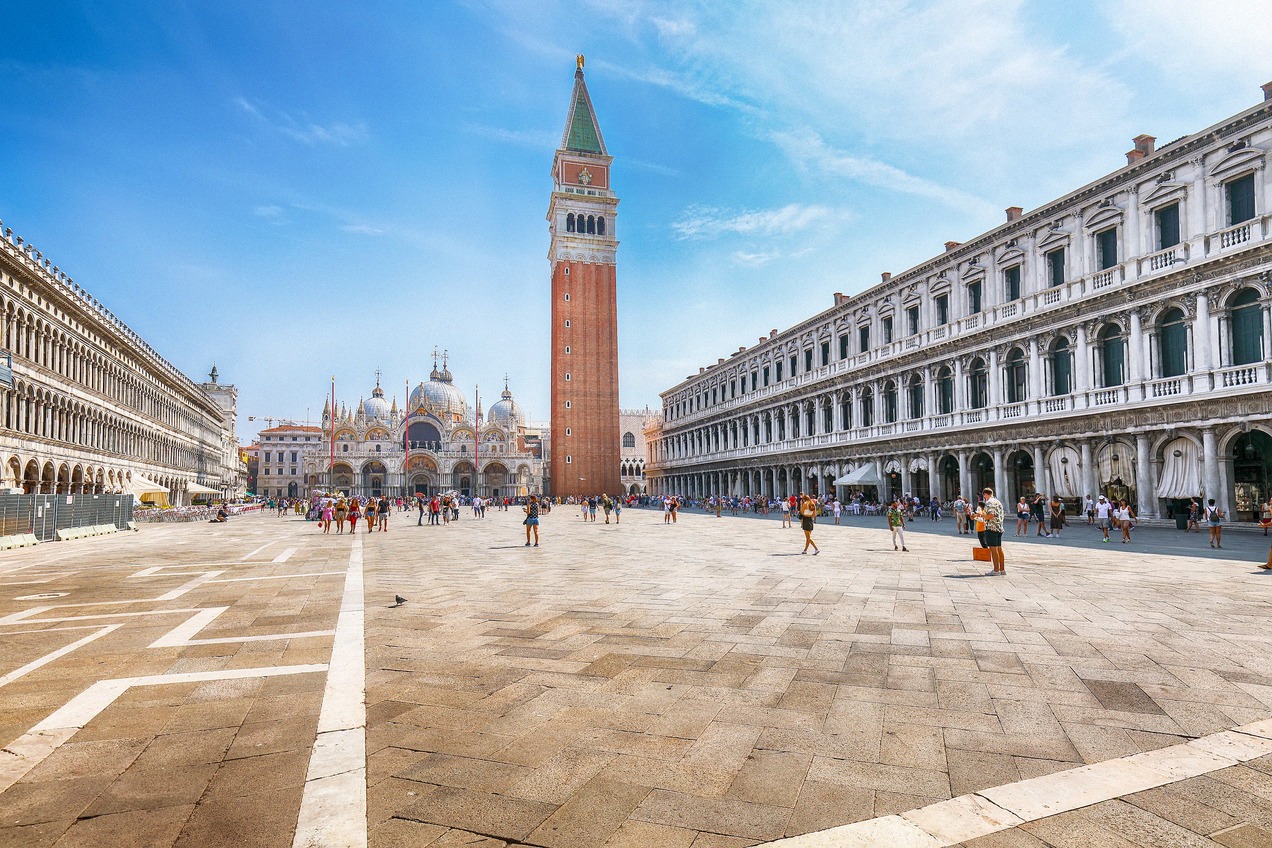 Wide-angle panorama of St. Mark's Square with the bell tower, St. Mark's Basilica and the Procuratie
